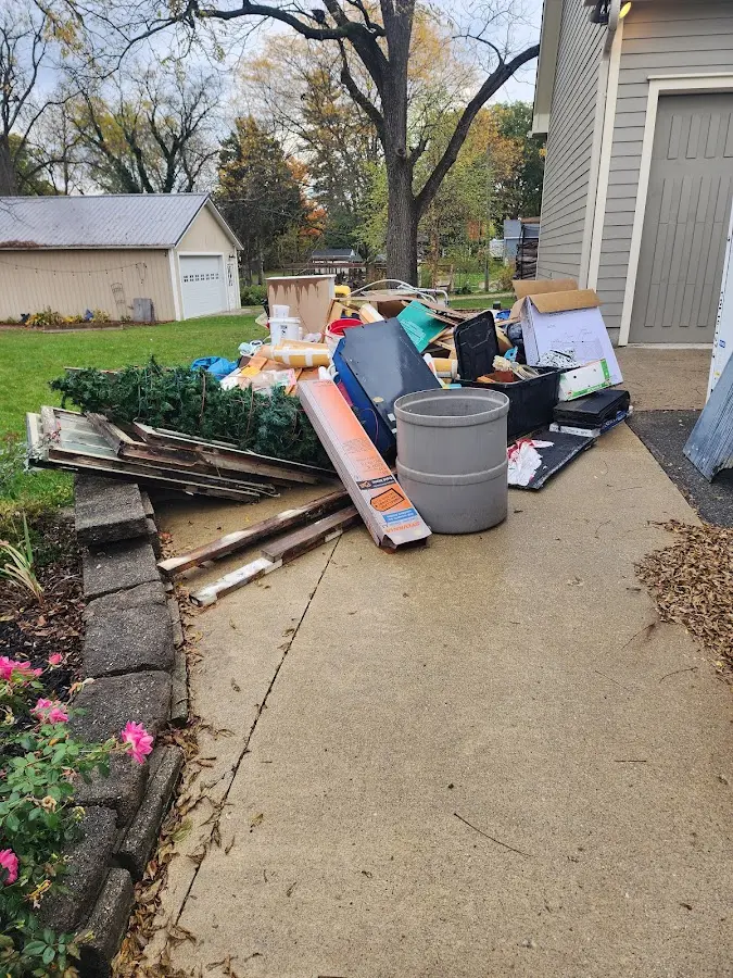 Dumpster being loaded with debris for 3 Yard Dumpster Rental in Medical Lake